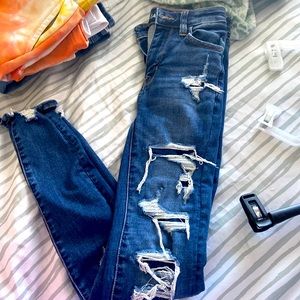 American eagle skinny jeans, holes with patches under